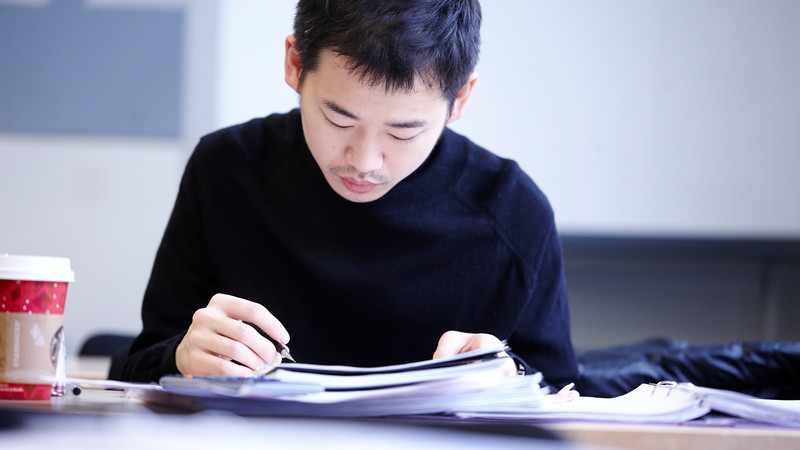 Man reading at a desk