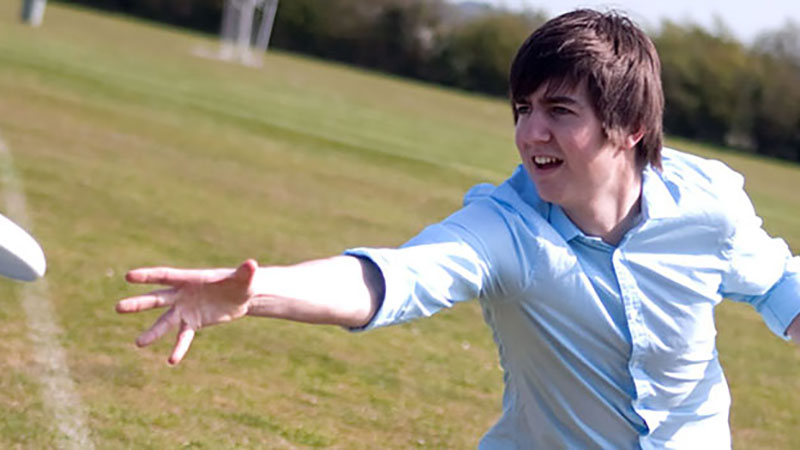 Student throwing a frisbee